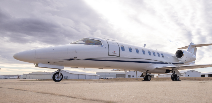 Side view of private aircraft on tarmac
