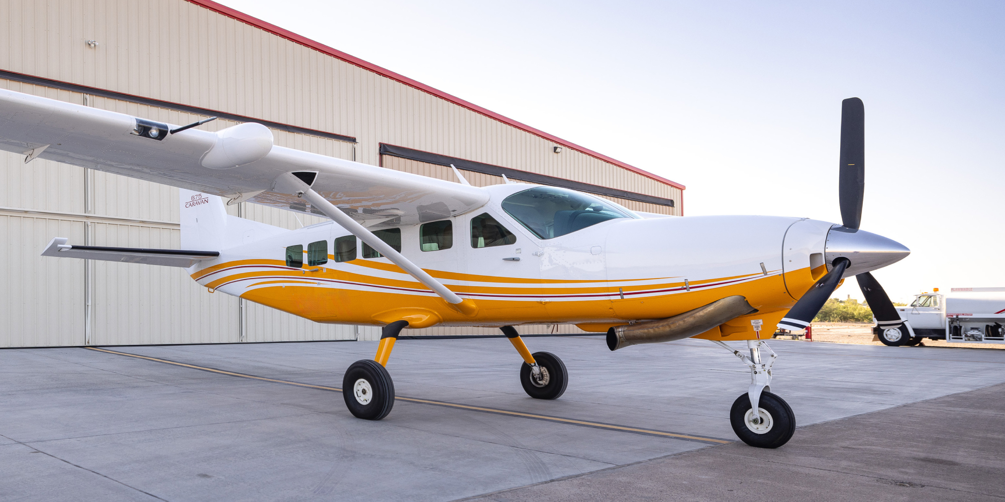 Plane in front of hangar