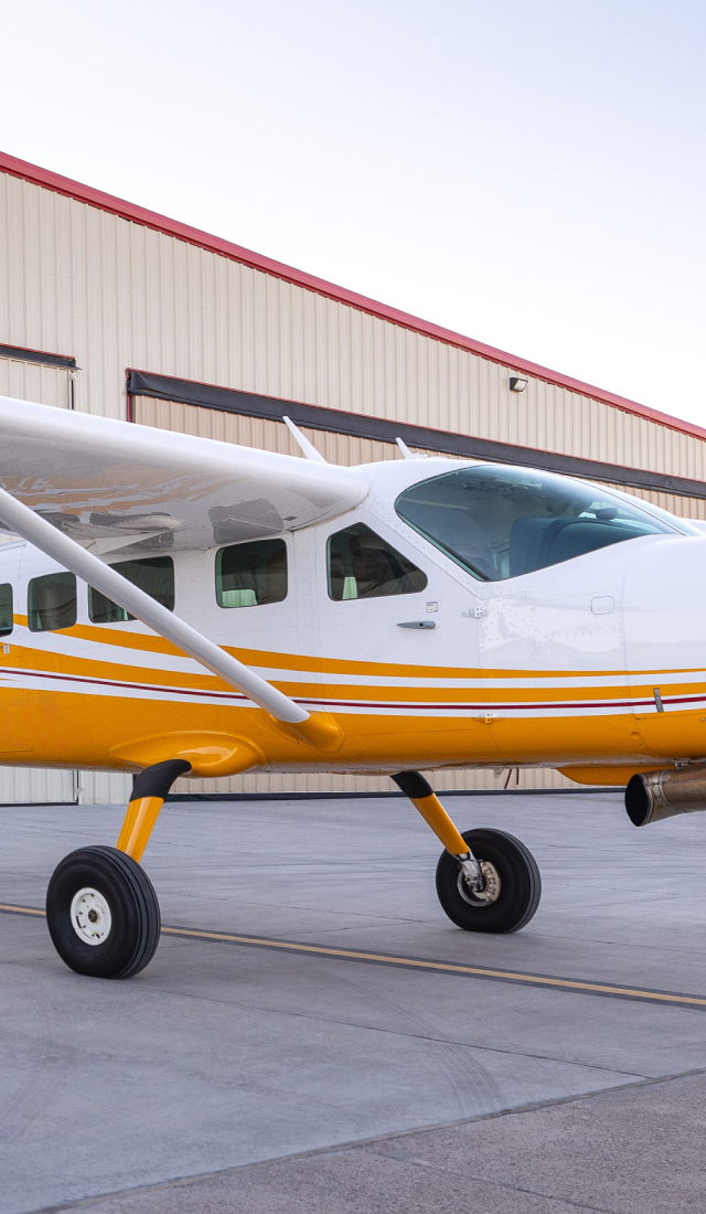 Plane in front of hangar