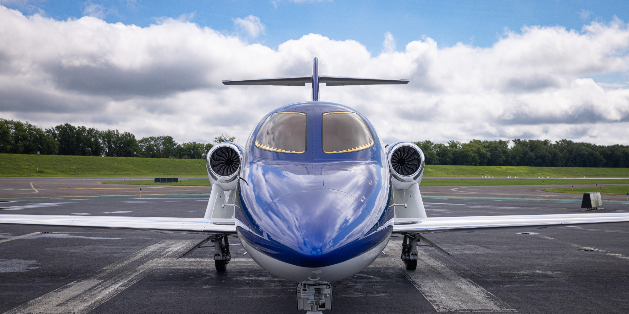 front view of private aircraft on tarmac
