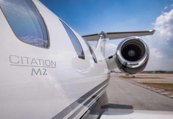 Close up of private aircraft windows and engine
